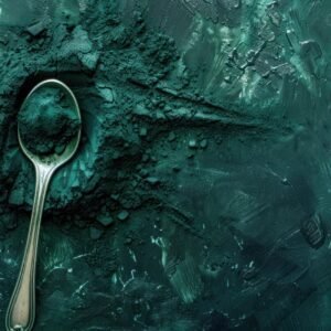 Blue Green Algae Powder With Spoon On Dark Background