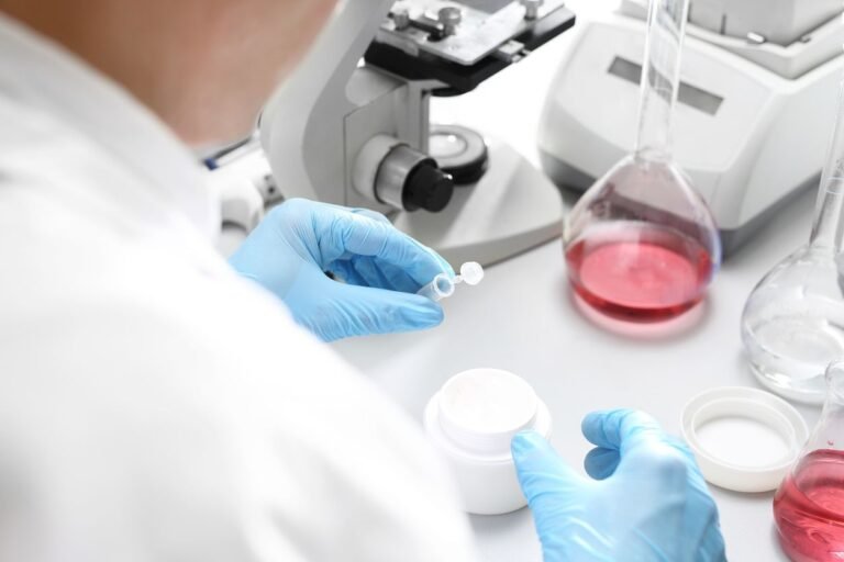 Cosmetic chemist reviewing MoCRA safety dossier and ingredient substantiation report for cosmetic actives 2025