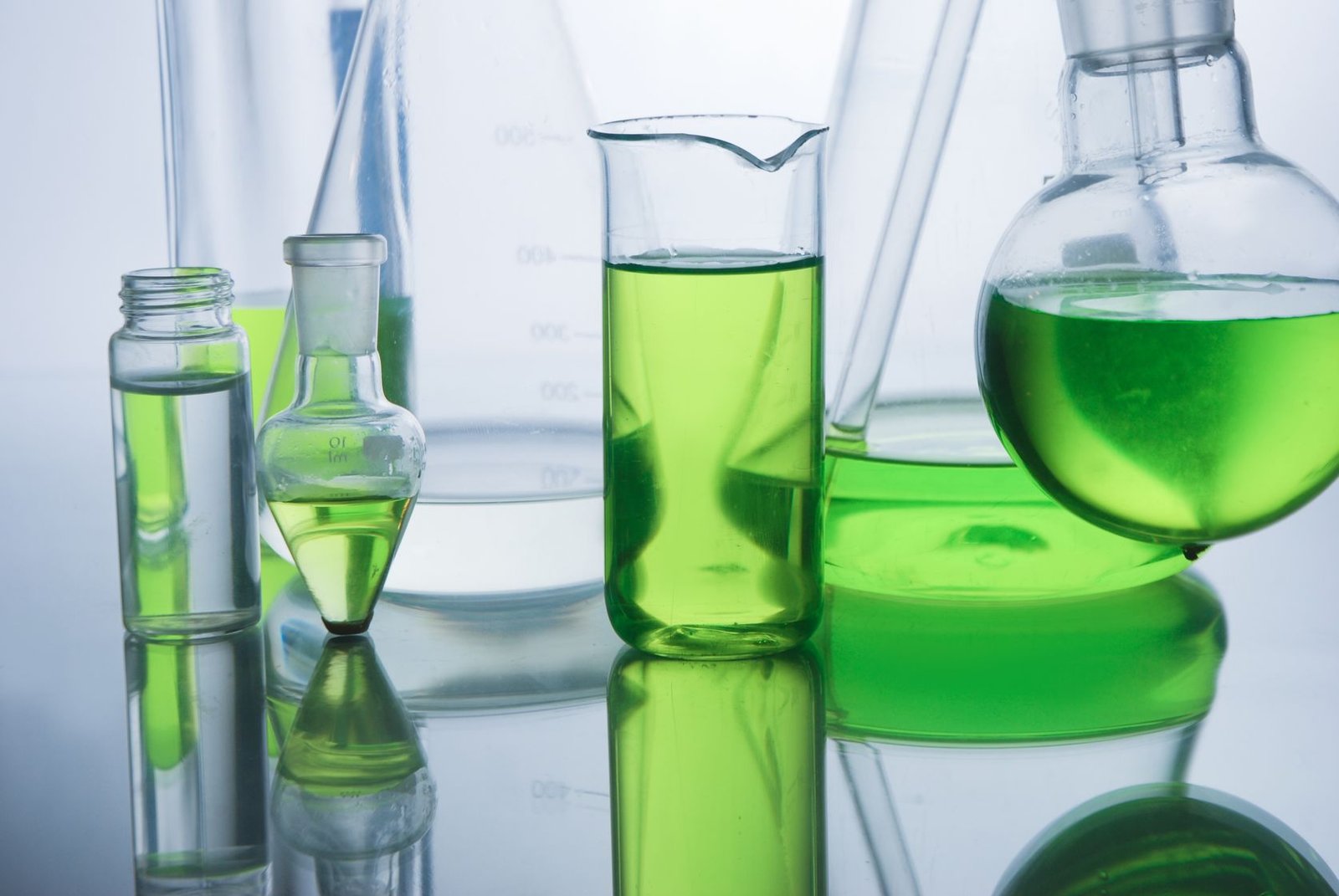 Cosmetic chemist testing bio-based solvents and biodegradable esters for sustainable formulation in 2026